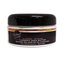 Jar of Whipped Goutti turmeric shea butter with black lid on a white background